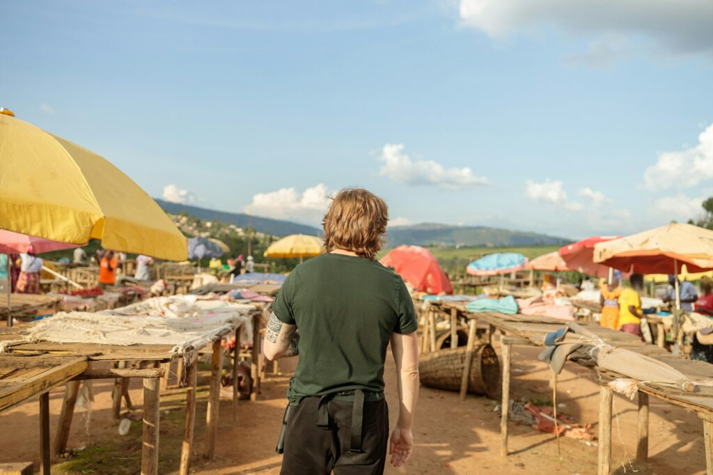 Young man visiting the Kimironko market in Rwanda
