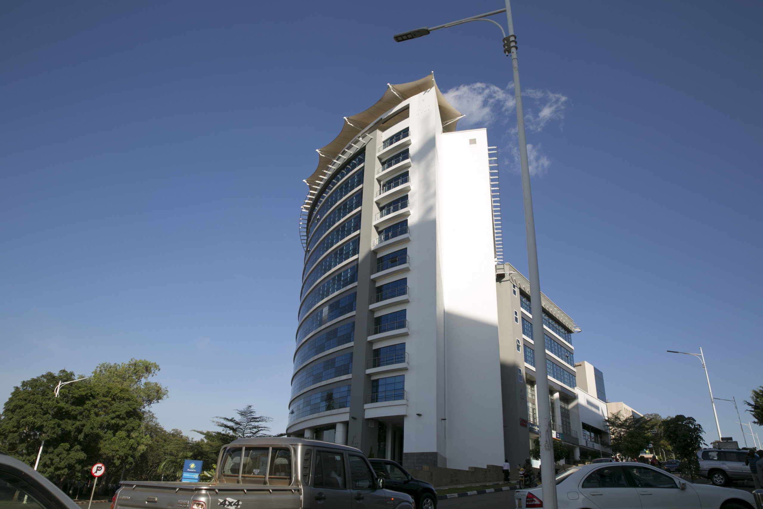 A stunning modern high-rise building in Kigali, Rwanda, showcasing the country's clean and organized urban environment. Rwanda is recognized as the safest travel destination in Africa, offering secure and well-maintained cities.