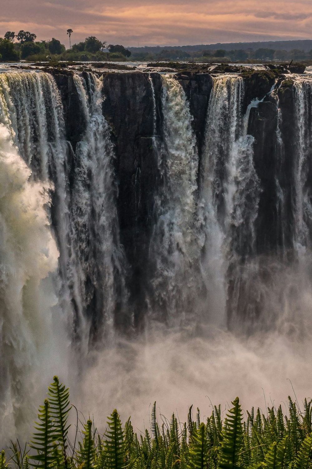 Scenic view of Mosi-Oa-Tunya Falls or Victoria Falls in Zambia Scenic view of Mosi-Oa-Tunya Falls or Victoria Falls in Zambia